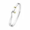 GEORG JENSEN ARMRING TORUN SØLV OG GULL